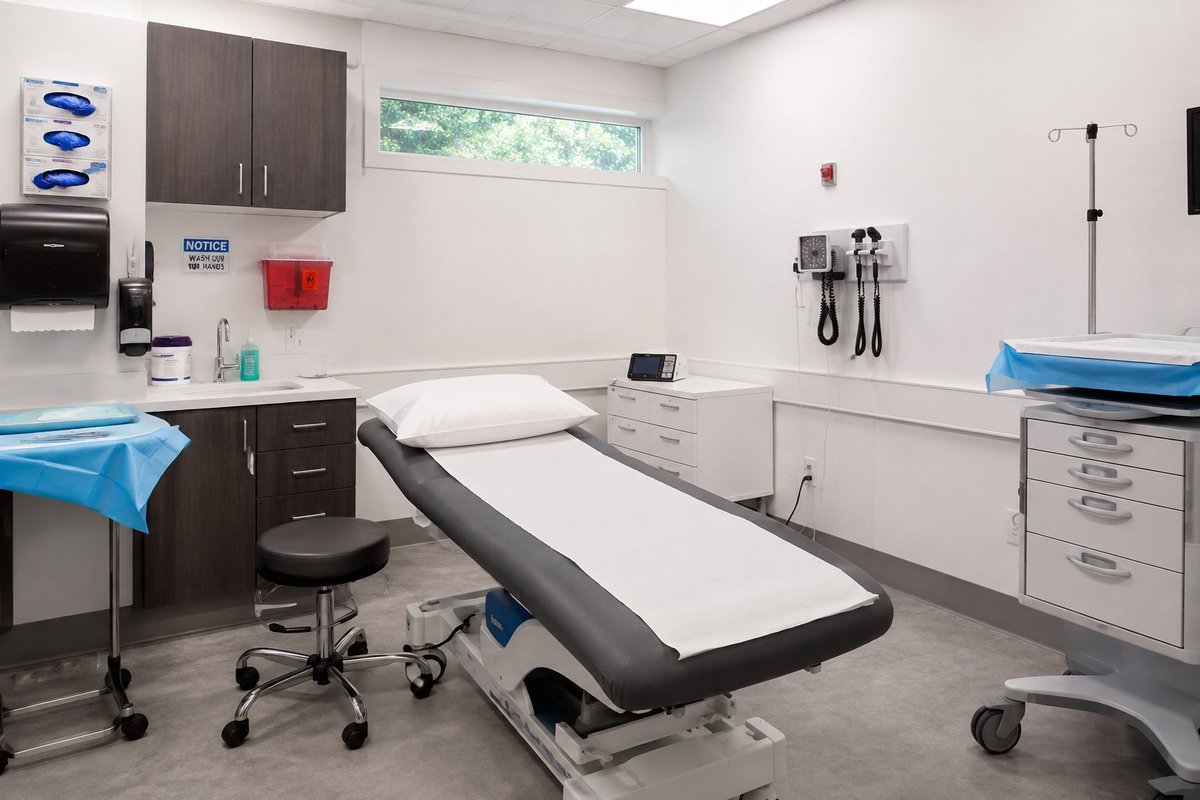 Finished dental operatory with treatment chair, sterilization supplies, and medical gas connections